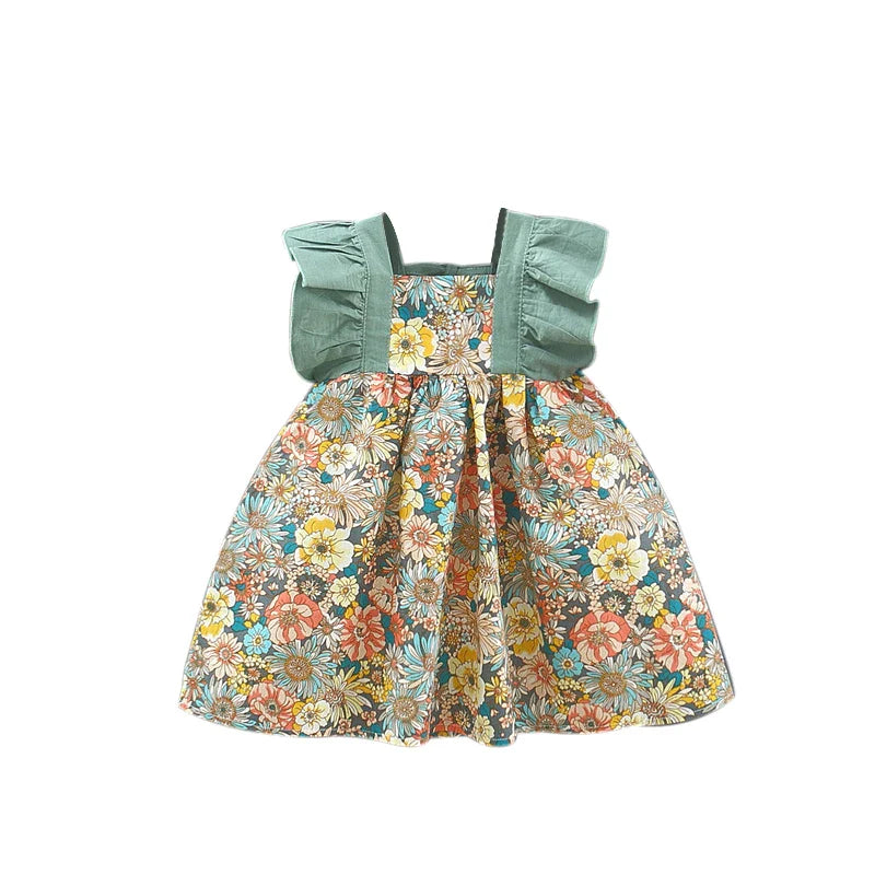 Floral baby dress with green ruffled shoulder straps and a gathered skirt