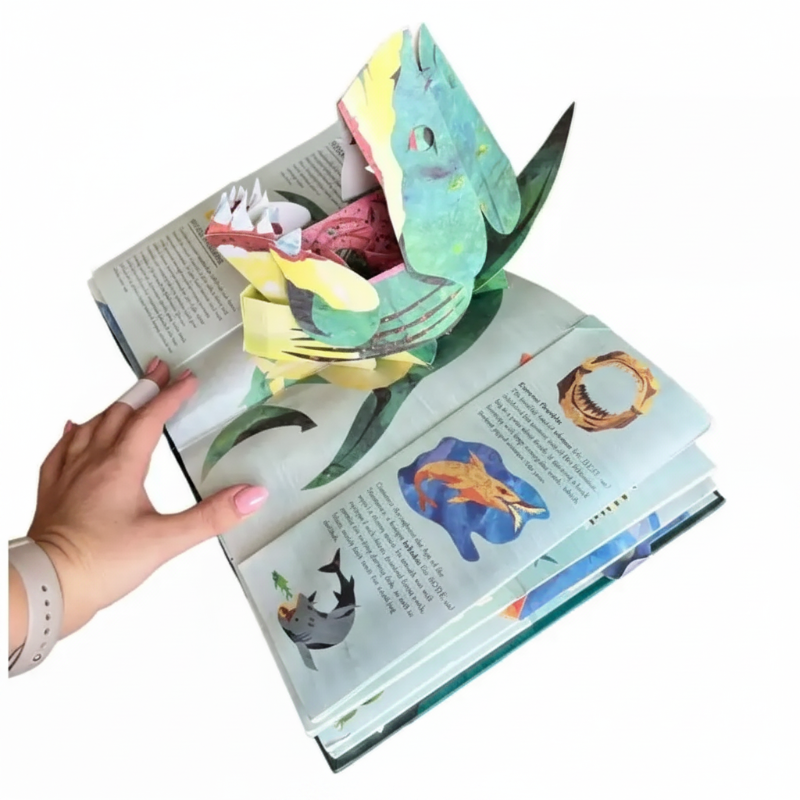 Open sea monster book with a large green shark pop-up and smaller illustrated creatures