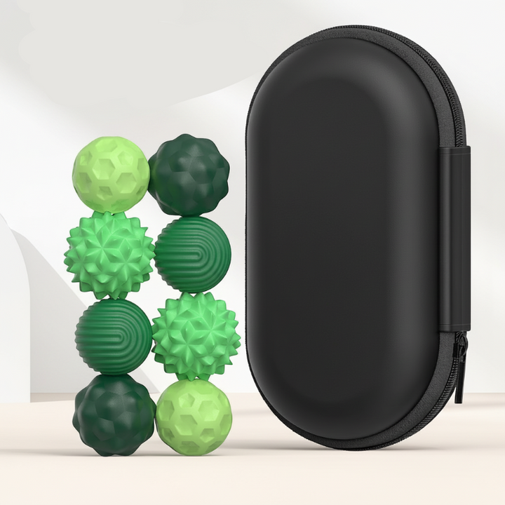 Eight small green textured magnetic beads beside a tall black zippered case
