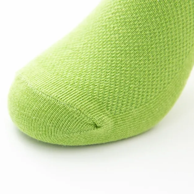 Close-up of the knit fabric and toe seam on a green sock
