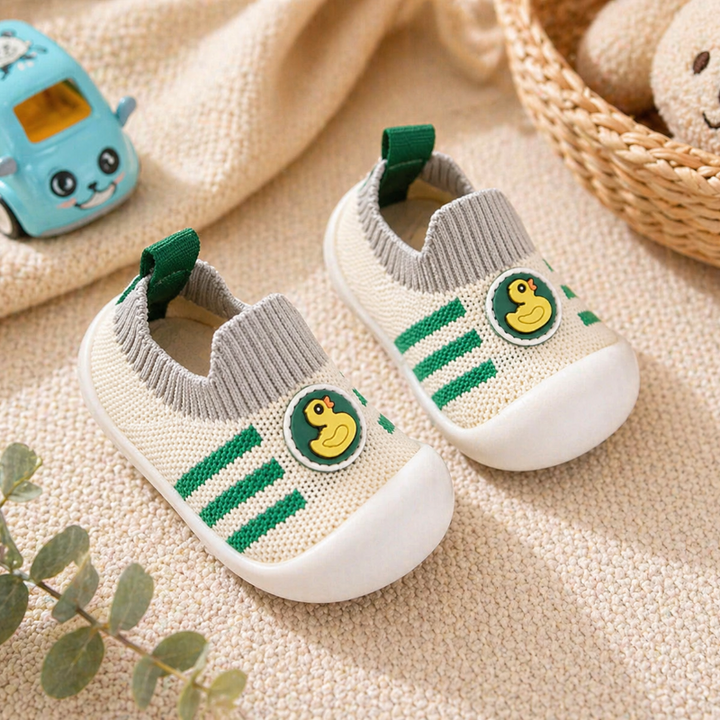 Green-striped duck sock shoes with gray knit cuffs and white toe caps.