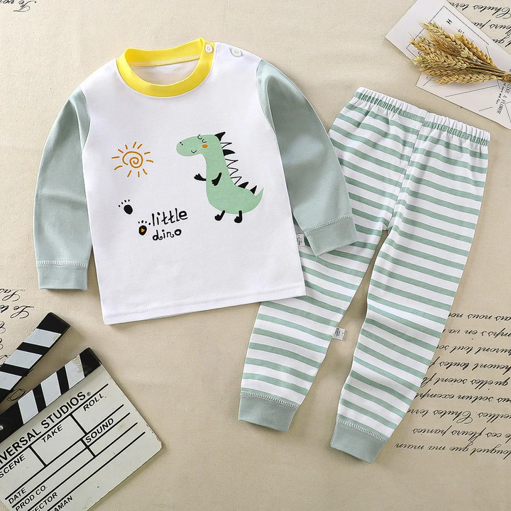 Dinosaur pajama top with light green sleeves and matching green-and-white striped pants