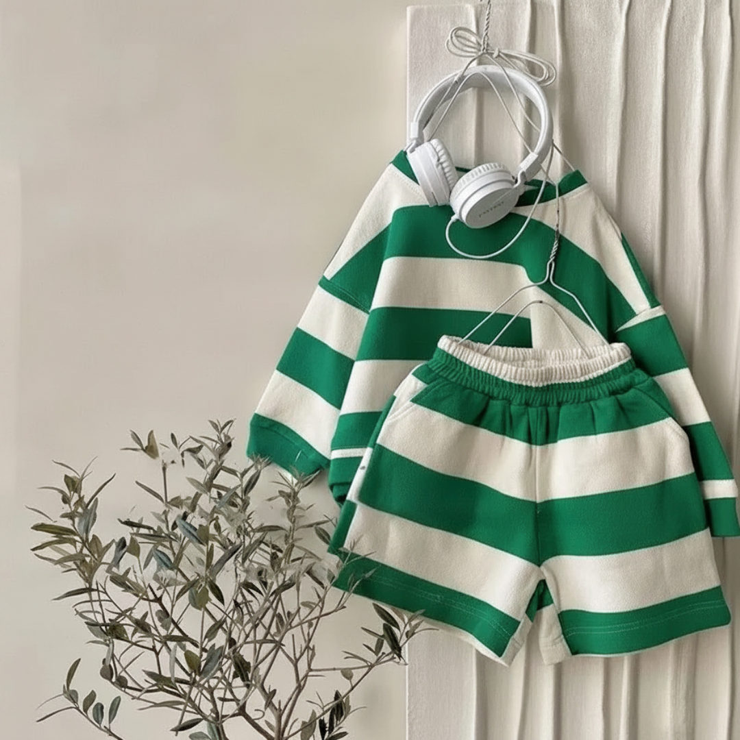 Green-and-cream striped long-sleeve top and elastic-waist shorts hanging together