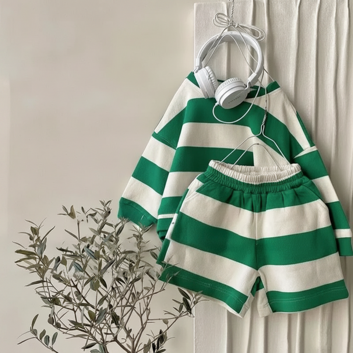 Green-and-cream striped long-sleeve top and elastic-waist shorts hanging together