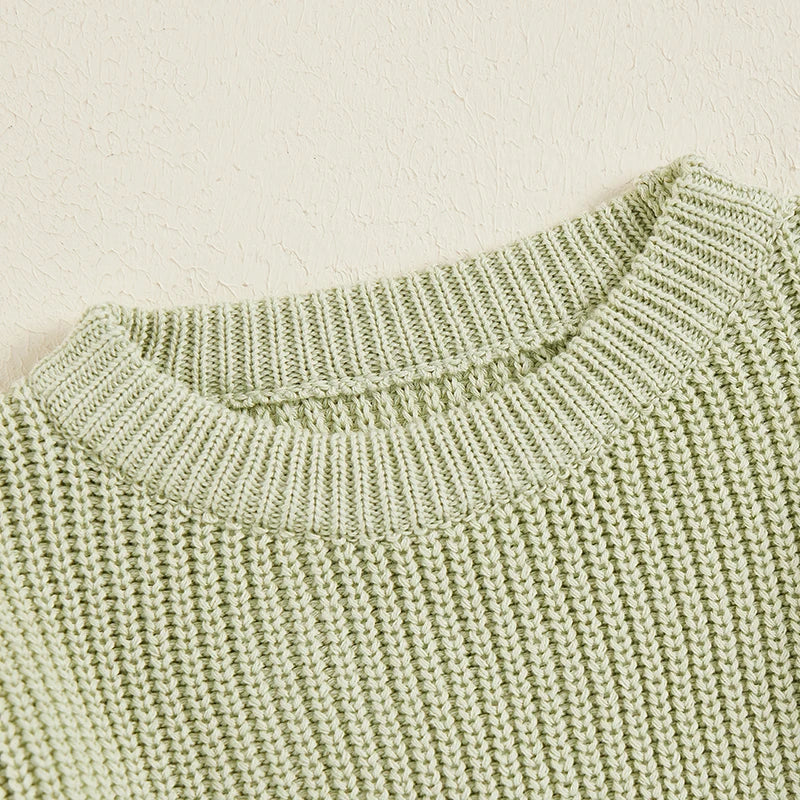 Close-up of the green sweater&