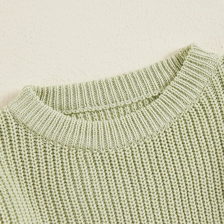 Close-up of the green sweater&