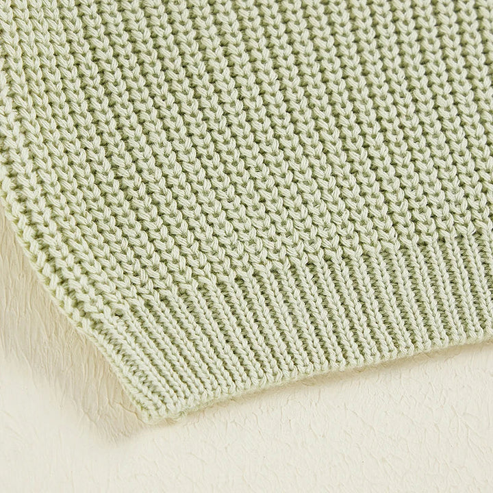 Close-up of the green sweater&