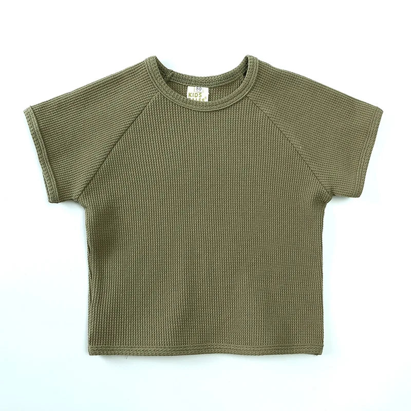Green textured children's T-shirt with a crewneck and short raglan sleeves