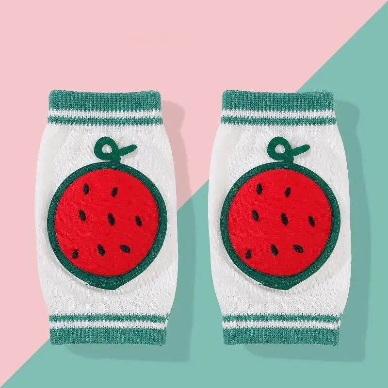 Pair of red watermelon knee pads with green trim and white knit sleeves.