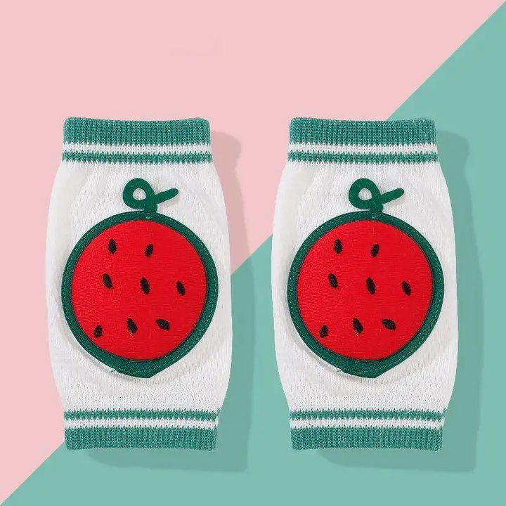 Pair of red watermelon knee pads with green trim and white knit sleeves.