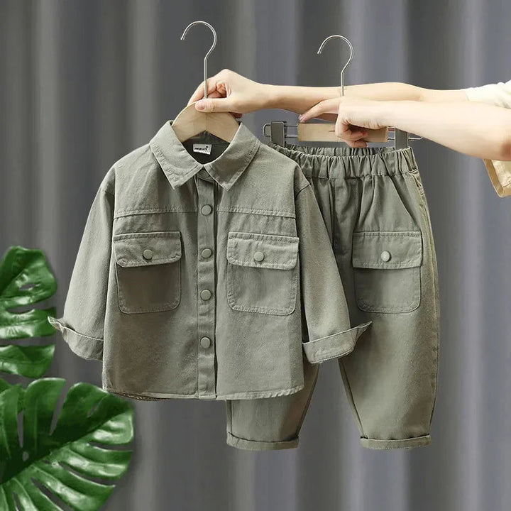 Green two-piece denim outfit with a collared shirt and elastic-waist pants
