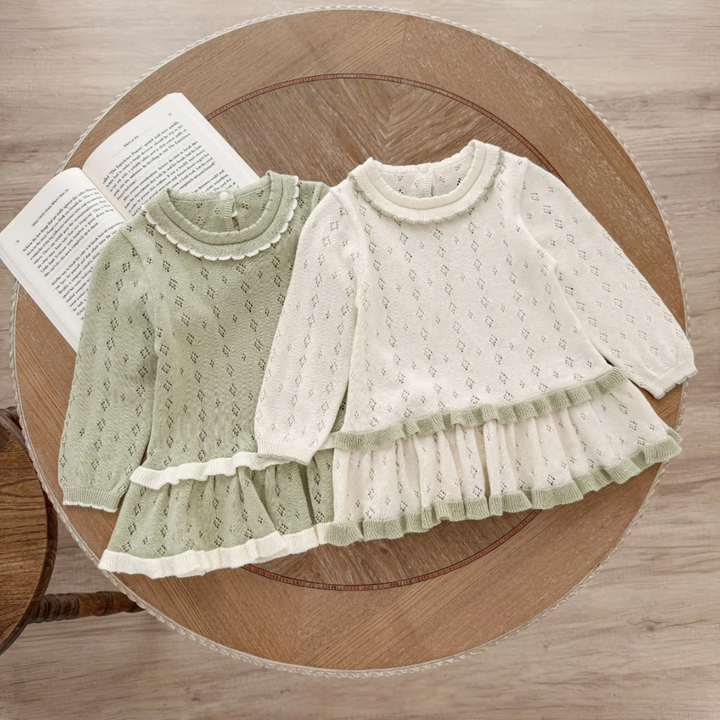 Green and white long-sleeve knit baby dresses with ruffled collars and contrasting skirt trim