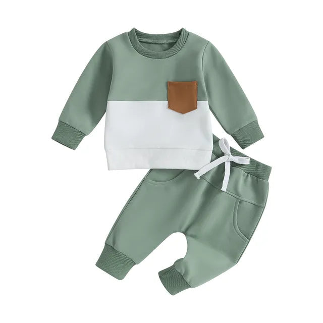 Green and white sweatshirt with a tan chest pocket paired with green joggers