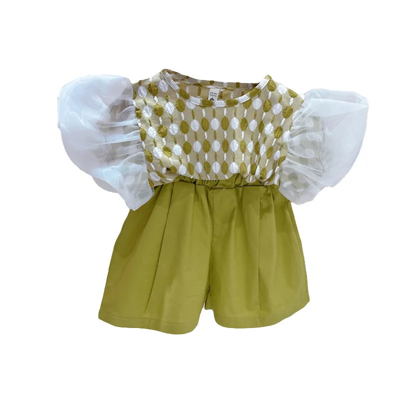 Front view of the green-and-white puff-sleeve top and green shorts set