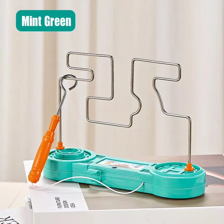 Green wire maze game with an orange loop wand and white connecting cord