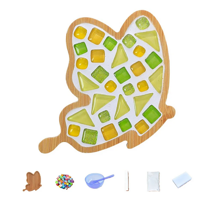 Green and yellow mosaic coaster in a tall bamboo outline, shown with crafting supplies