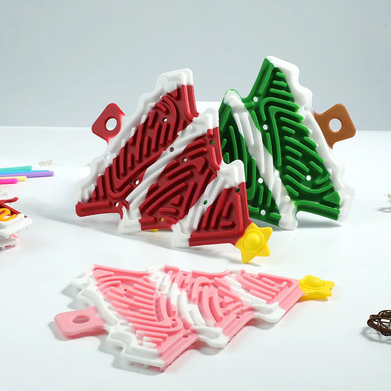 Grooved Christmas tree fidget bases with white snow accents and yellow stars