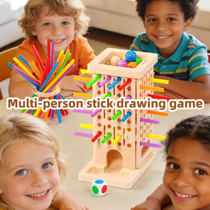 Four children gathered around a stick-pulling tower with colorful sticks and balls