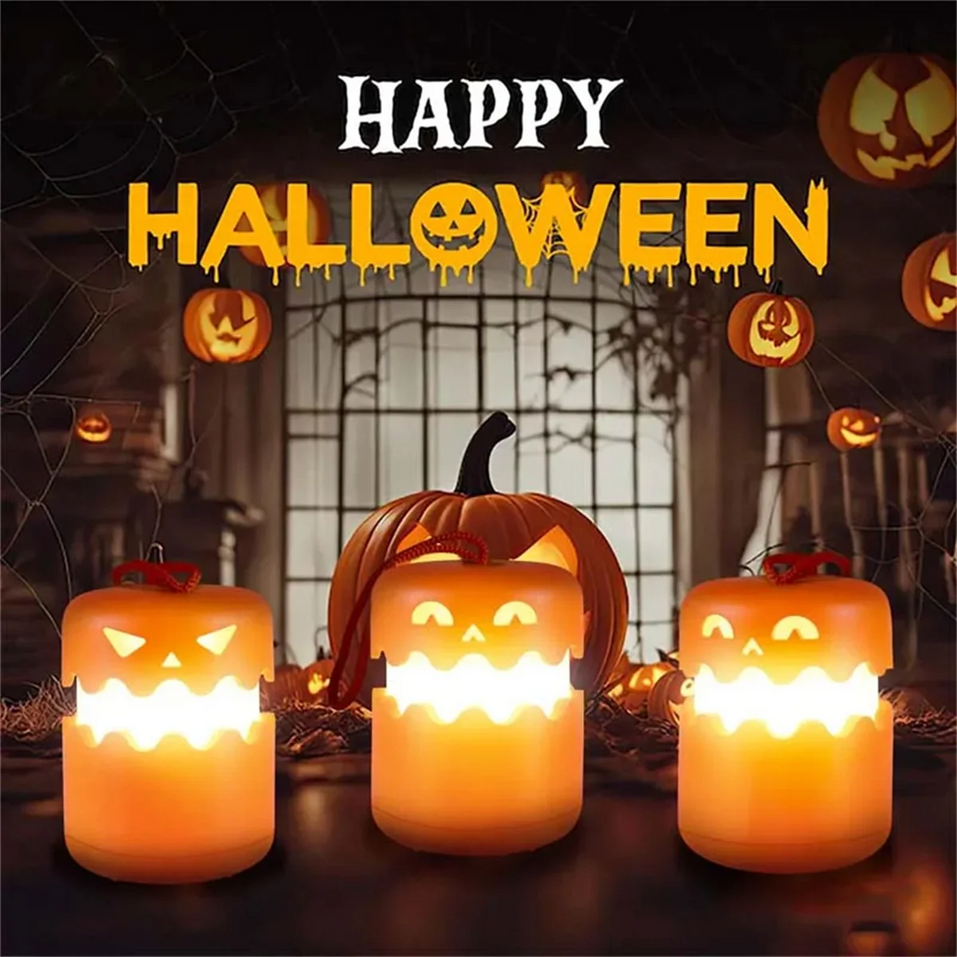 Three illuminated pumpkin lanterns arranged in a Halloween table display