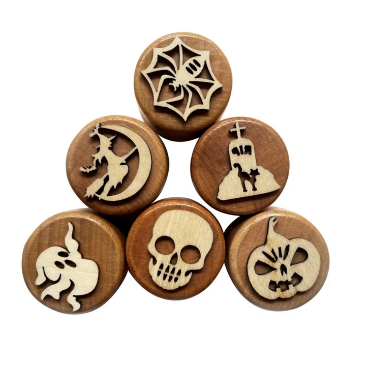 Halloween wooden clay stamps with spiderweb, witch, haunted house, ghost, skull, and pumpkin designs.