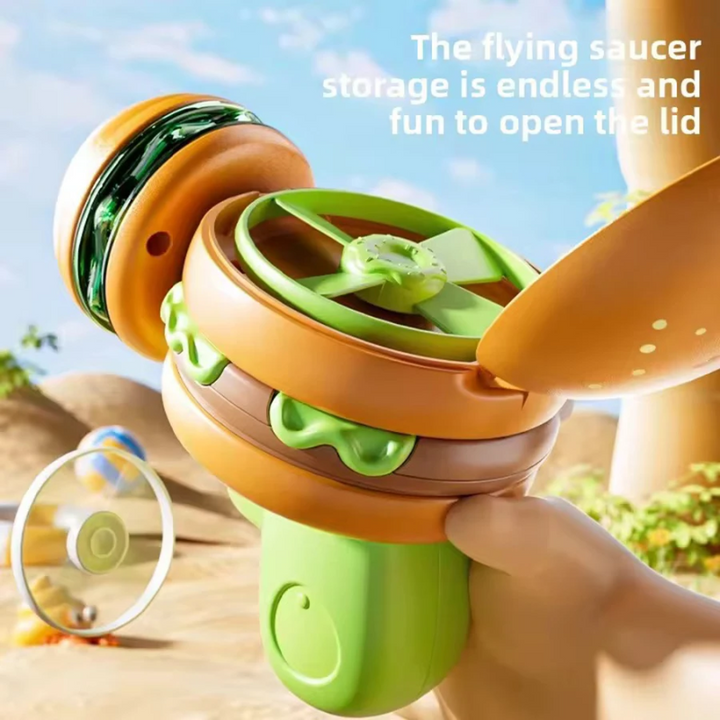 Hamburger launcher with its top open and a green flying disk stored inside