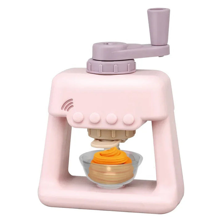 Pink hand-crank clay ice cream maker with an orange clay swirl in a gray dessert cup.