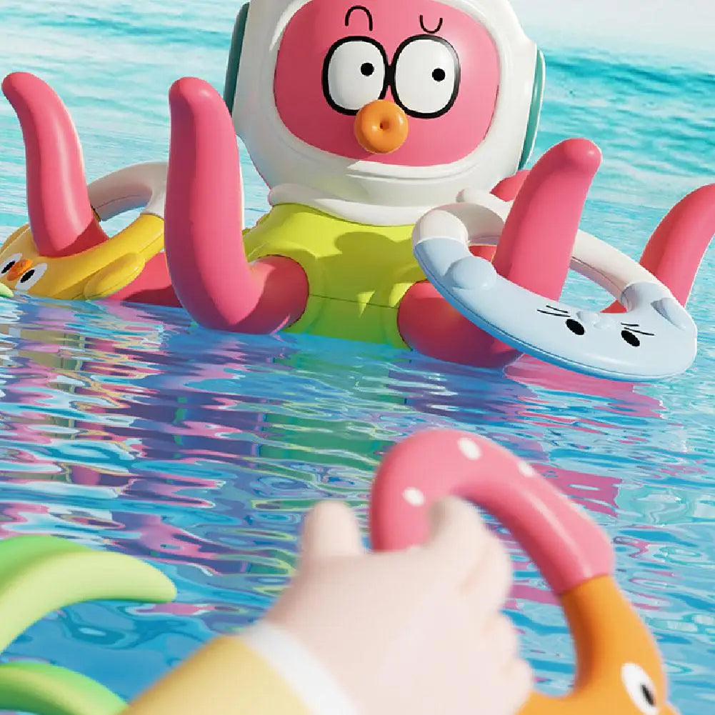 Hand holding a colorful ring in front of the octopus bath toy in water
