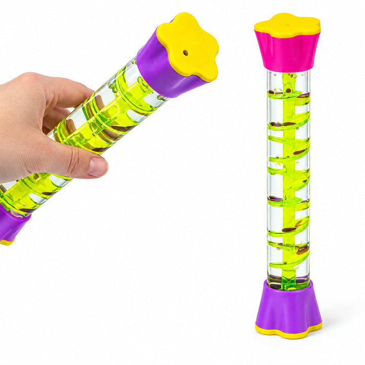 Hand tilting a spiral sensory tube beside an upright tube