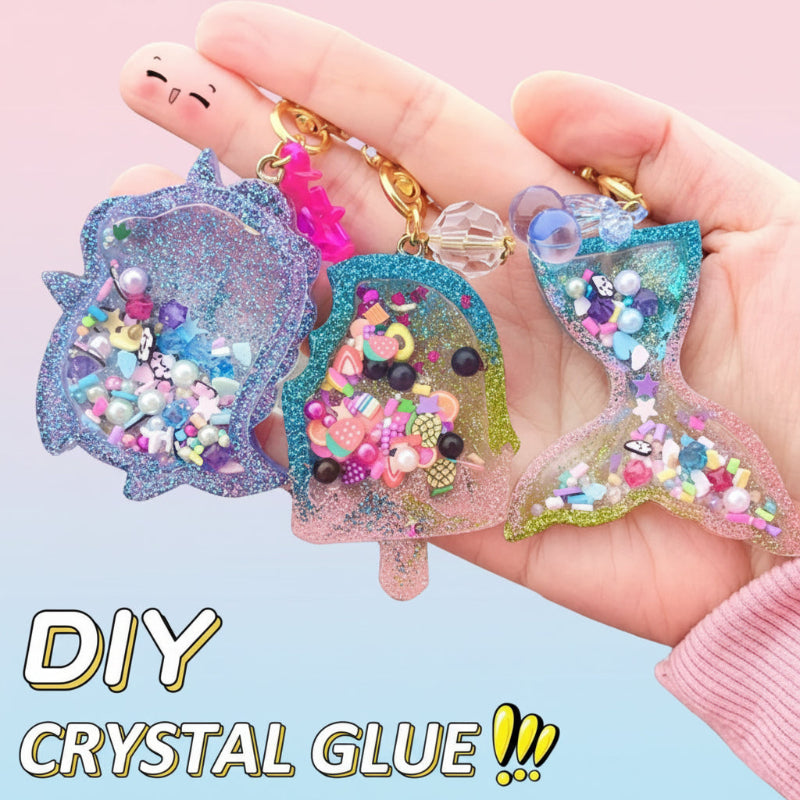 Hand holding three glitter-filled shaker keychains with beads and colorful decorative fillers