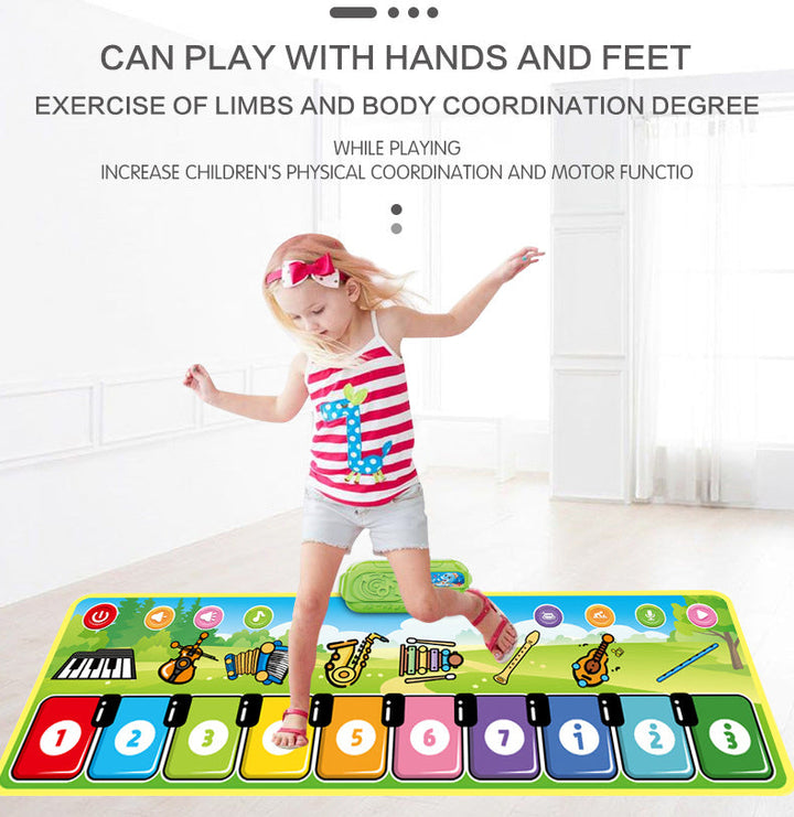 Child stepping on musical keys in a demonstration of hands-and-feet play