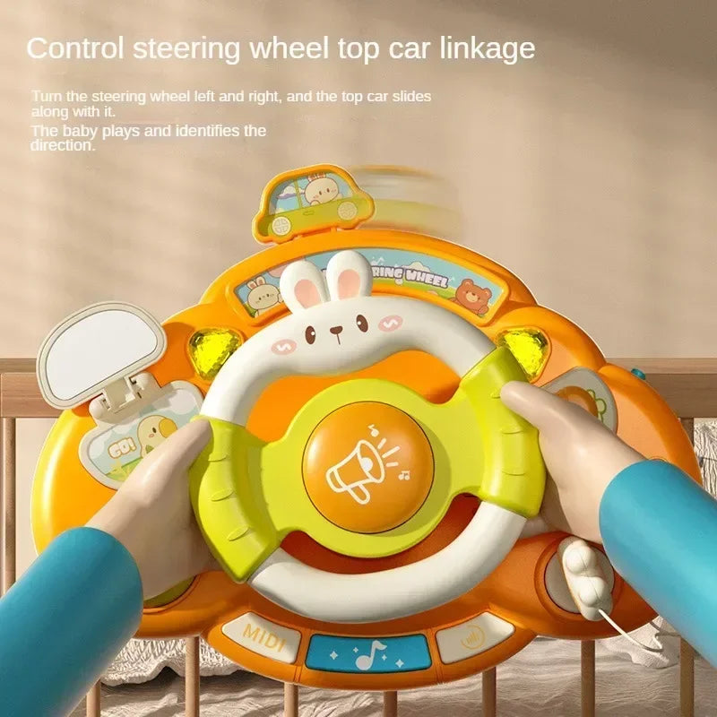 Hands holding the toy steering wheel with a mirror, play key, and colorful buttons