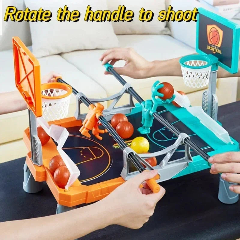 Hands turning the controls on an orange and teal tabletop basketball game