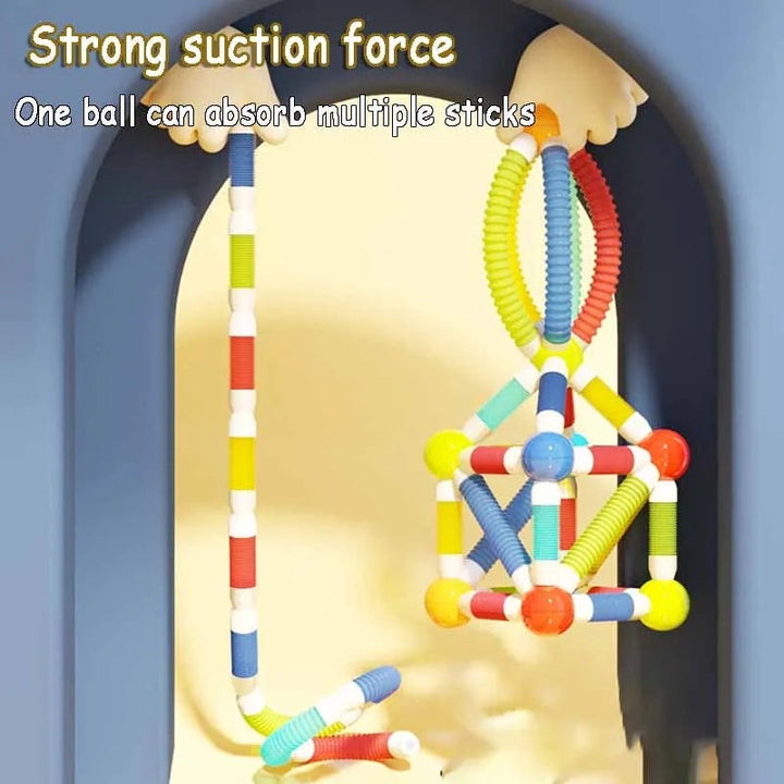 Magnetic rods and ball connectors shown holding hanging geometric builds