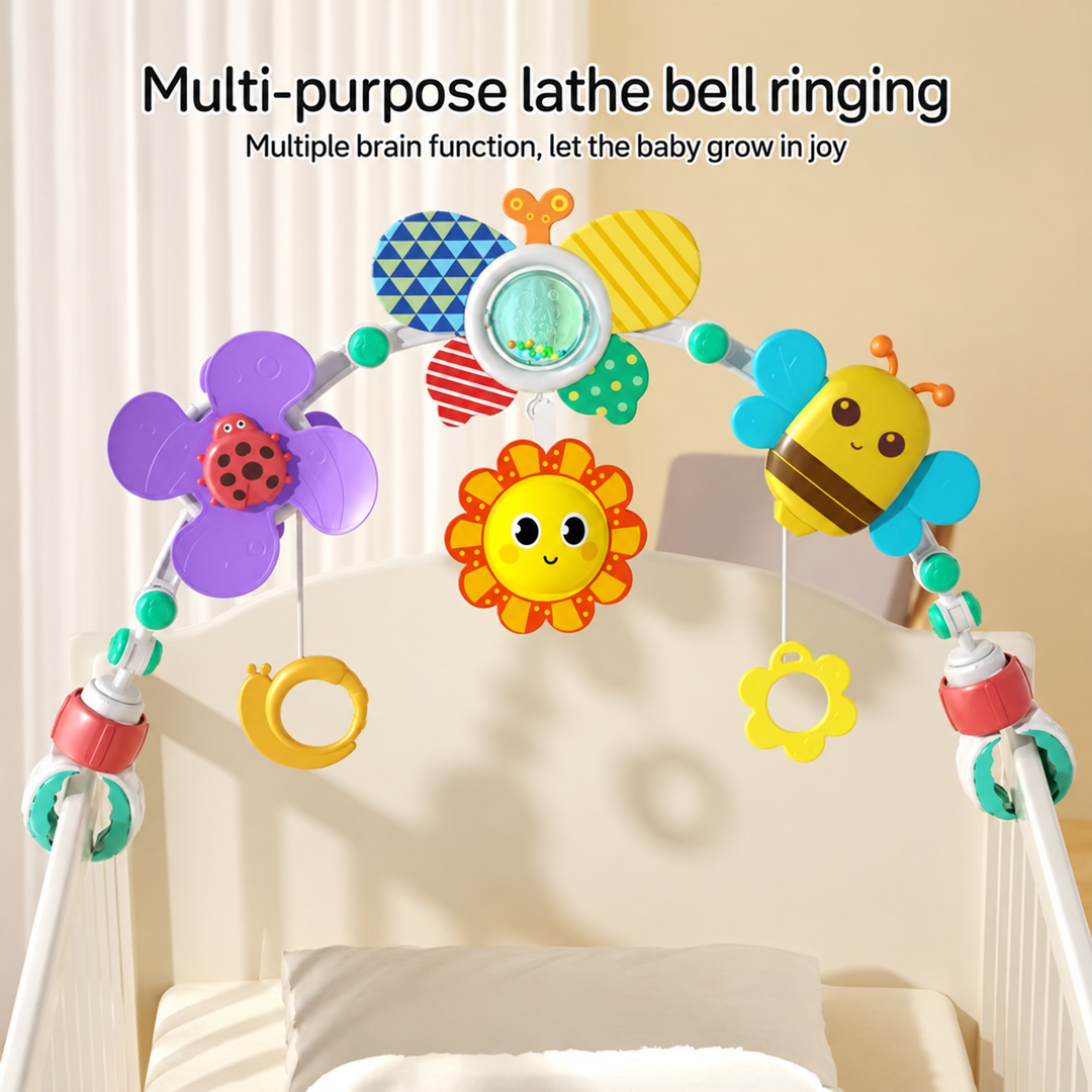 Colorful baby play arch with hanging rings positioned over a crib