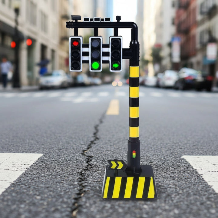 Three hanging traffic signals on a black-and-yellow striped post with a rectangular base.