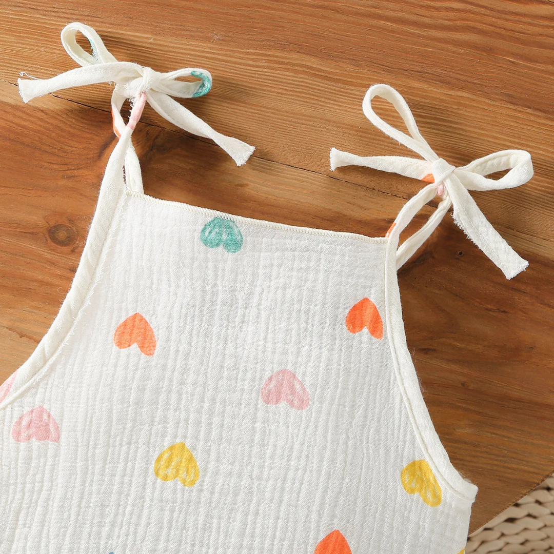 Heart-print baby bodysuit with a straight neckline and tie shoulder straps
