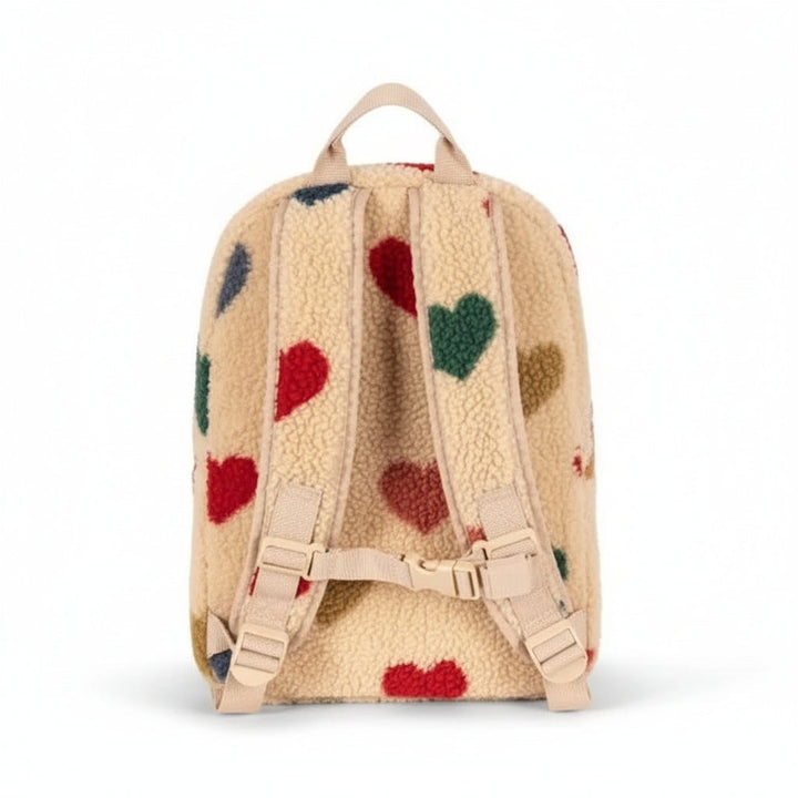 Back of the beige heart teddy backpack with adjustable shoulder straps and a buckle strap
