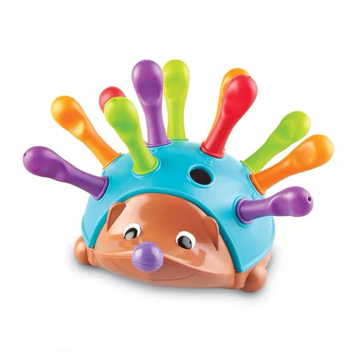 Front view of a blue hedgehog toy with colorful quills and an empty slot