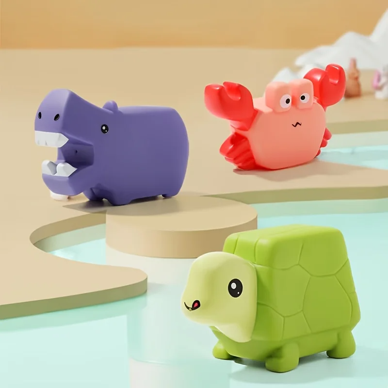 Purple hippo, red crab, and green turtle bath toys in a three-piece animal set