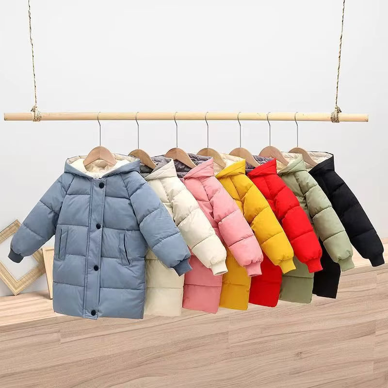 Blue quilted winter coat at the front of a rack of kids&