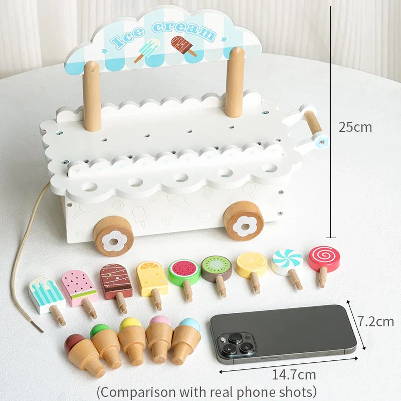 White ice cream cart with a 25 cm height measurement, pretend treats, and a phone for scale