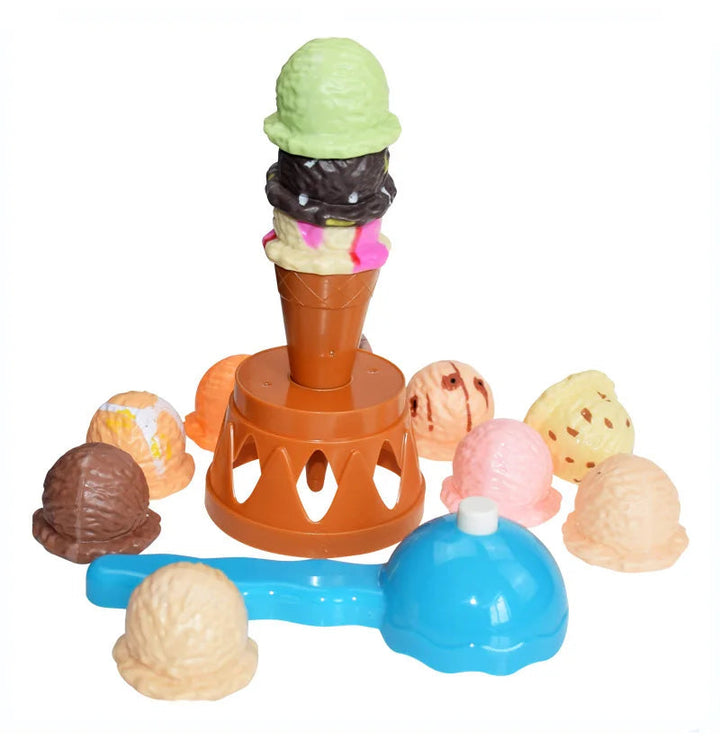 Ice cream stacking game with loose colorful pieces, a cone on an orange stand, and a blue scoop