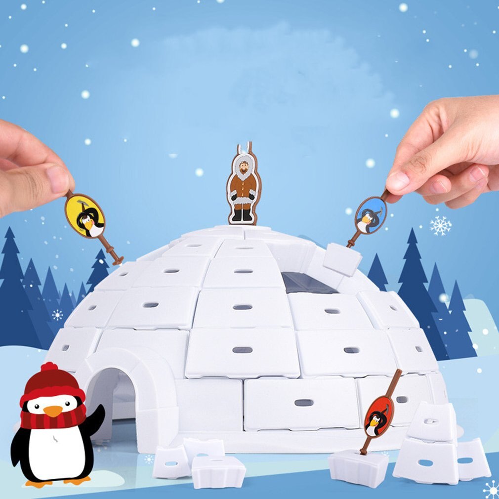Hands using colorful character-handled picks to remove blocks from the igloo