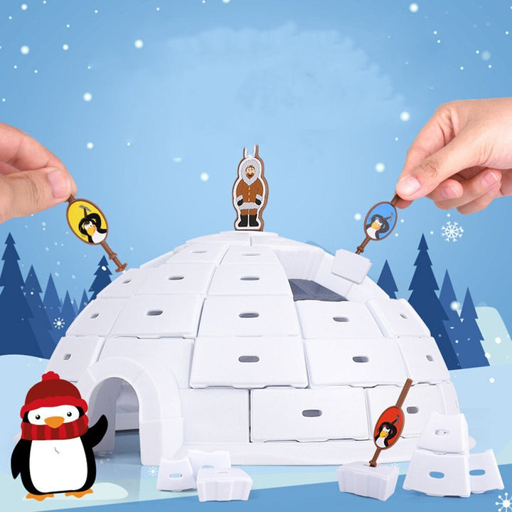 Hands using colorful character-handled picks to remove blocks from the igloo