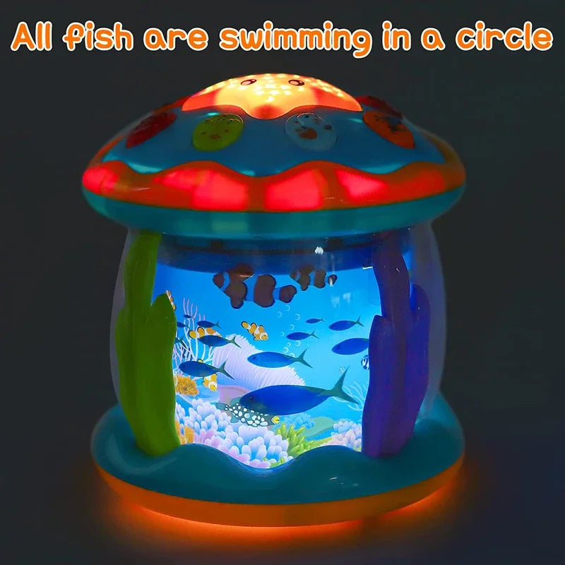 Illuminated aquarium toy displaying colorful fish beneath a glowing multicolor top