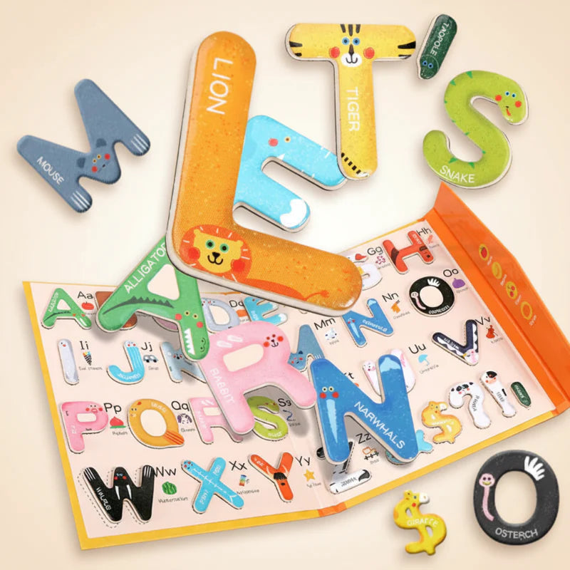 Colorful illustrated magnetic letters scattered across an open alphabet puzzle book