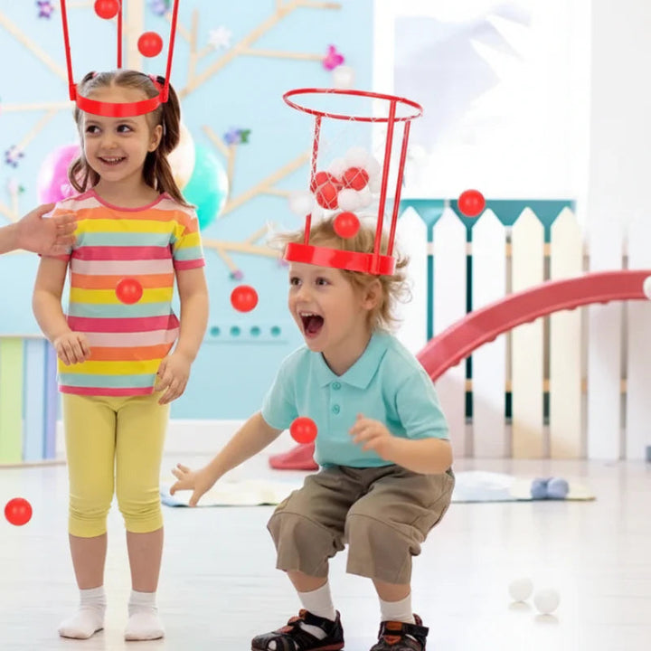 Two children wearing red basketball hoop headbands during indoor play