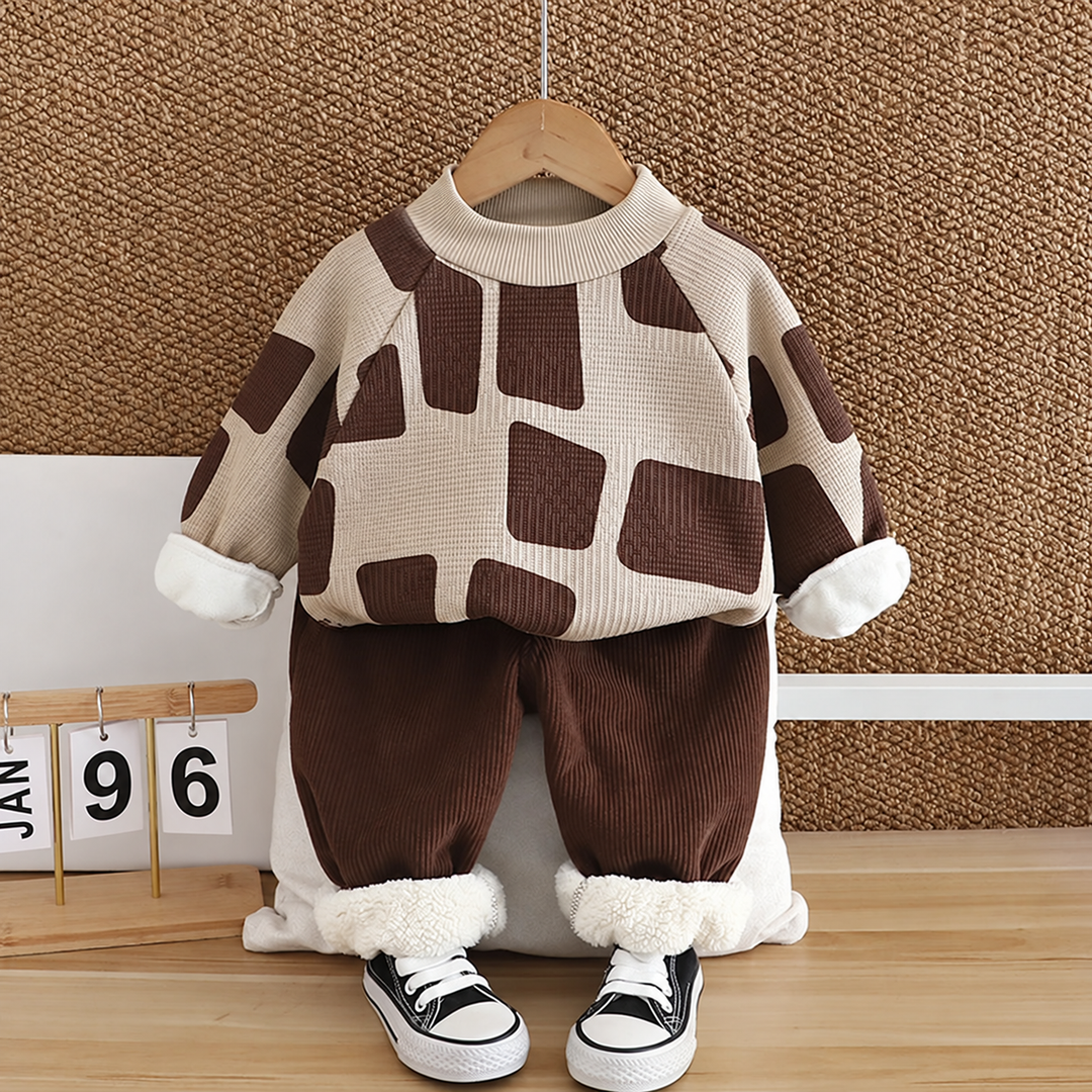 Khaki sweater with dark brown blocks and brown pants with white fleece cuffs