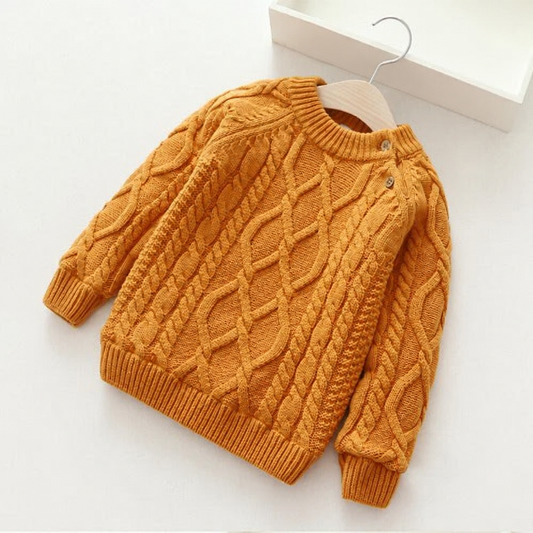 Khaki cable-knit sweater with long sleeves, ribbed edges, and shoulder buttons.