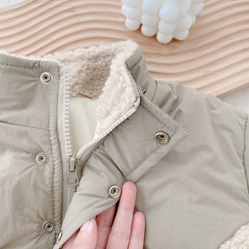 Khaki jacket collar showing fleece trim, zipper, and snap-button placket
